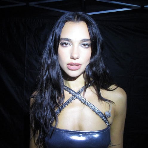 dua lipa wearing a silver bra top