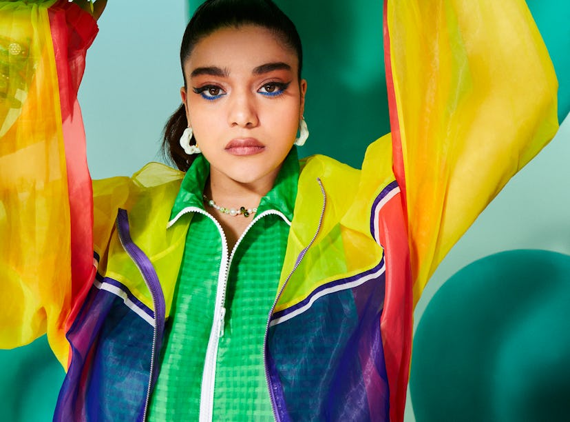 Iman Vellani wears Y2K fashion and Y2K accessories including tod’s windbreaker, armani exchange jack...