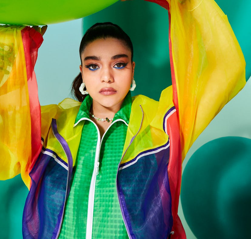 Iman Vellani wears Y2K fashion and Y2K accessories including tod’s windbreaker, armani exchange jack...