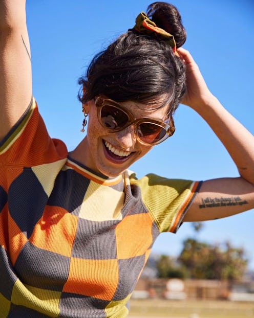 woman wearing wide-rimmed cat eye sunglasses