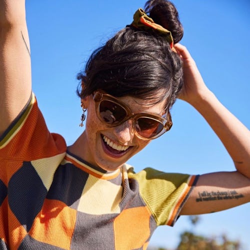 woman wearing wide-rimmed cat eye sunglasses