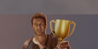 Nathan Drake holding trophy