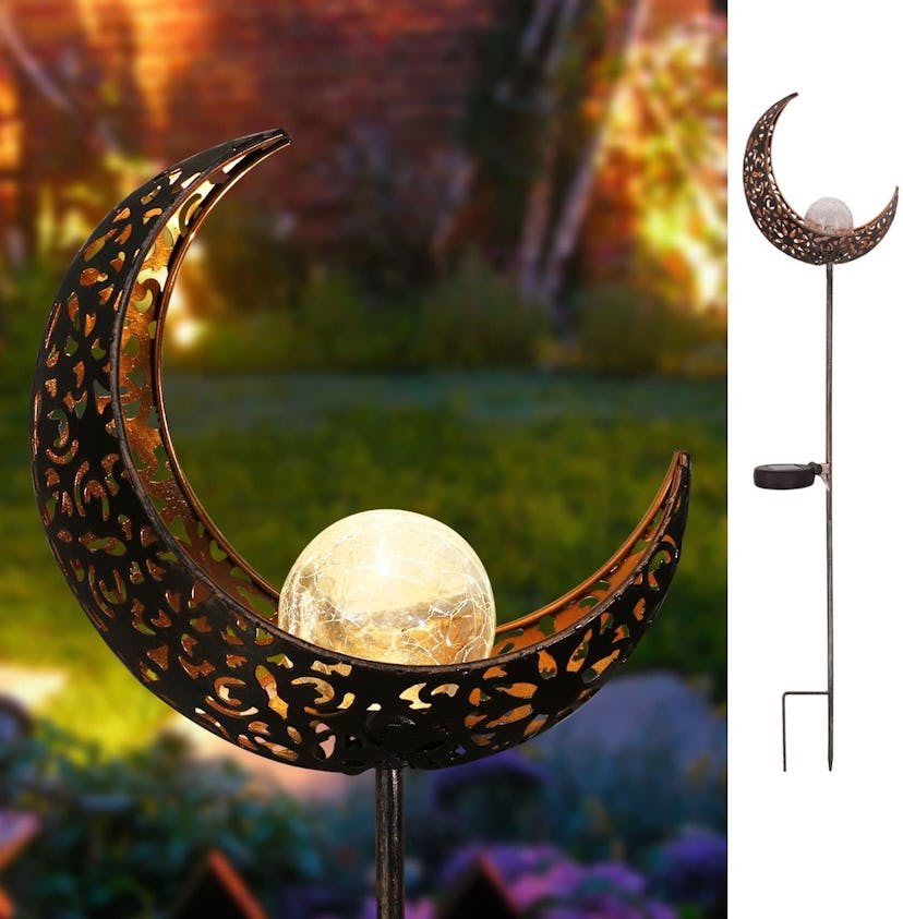 A moon-shaped solar path light gives the backyard a mystical touch.