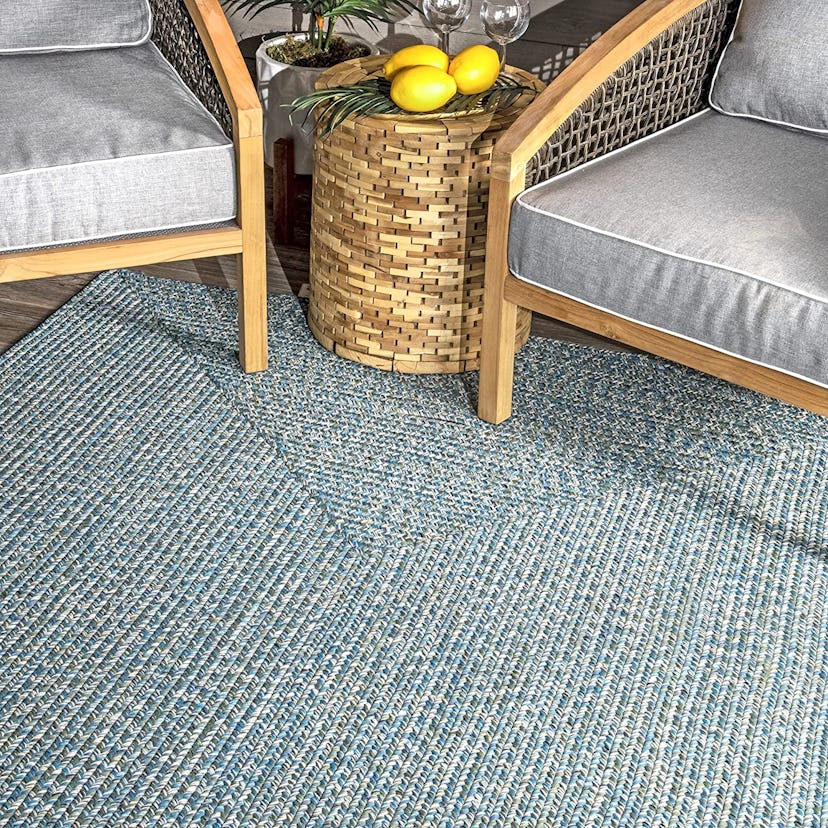 The durable construction of this nuLoom rug makes it ideal for outdoor use.