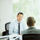 Smiling businessman having meeting with client