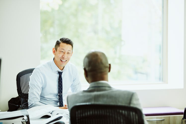 Smiling businessman having meeting with client