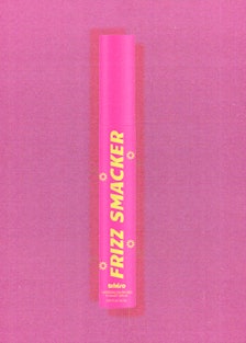 A tube of hair serum called Frizz Smacker against a pink backdrop