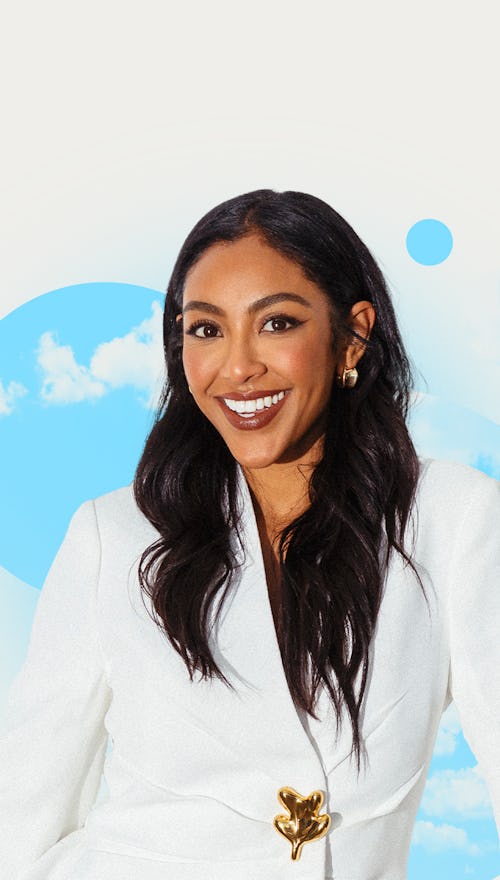 Tayshia Adams smiling for an exclusive interview in a white blazer with Elite Daily's Chill Sesh