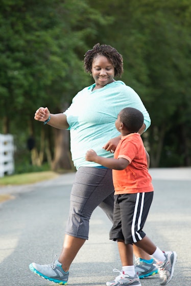 A mother and son with childhood obesity go on a walk for fitness.