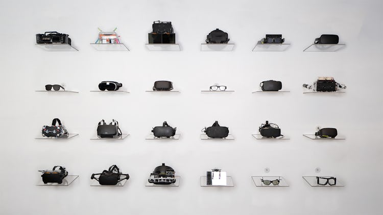 A wall of VR headset prototypes.