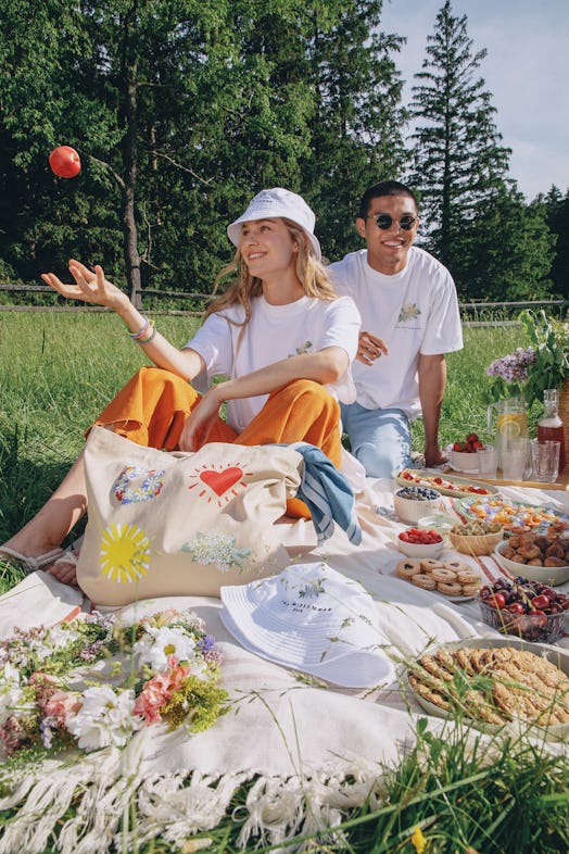 IKEA's BLOMMA collection is worn and displayed by friends at a summer picnic.