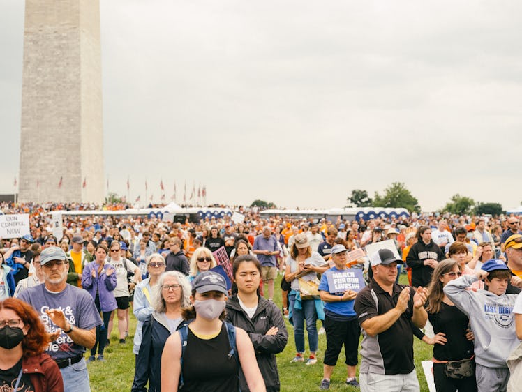 A photo showing the large crowd of attendees beneath the Washington Monument, listening to the speak...