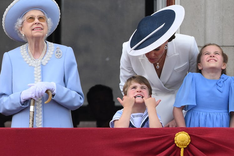 Queen Elizabeth II, Prince Louis, Kate Middleton, and Princess Charlotte on the balcony of Buckingha...