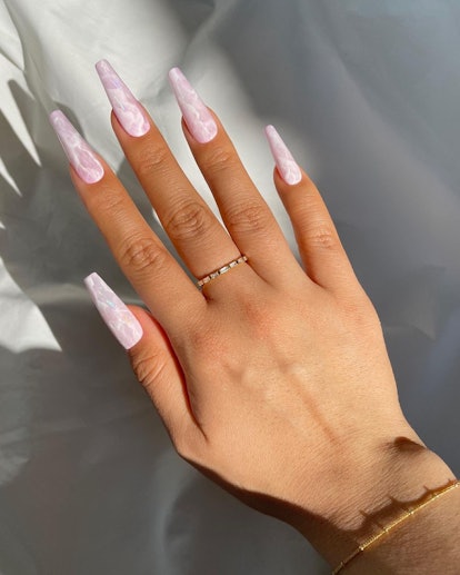 These coffin-shaped nails look gorgeous with a rose quartz design.