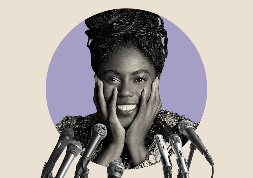 Abrima Erwiah smiling in front of seven microphones