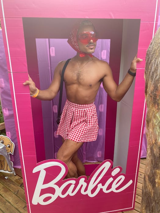 Tomás Matos posing in a pink Barbie photo frame 