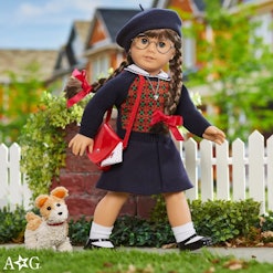 Molly McIntire doll posed in an argyle sweater and beret.