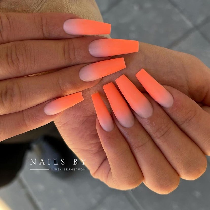 Neon orange nails are a summery design perfect for coffin-shaped tips.  
