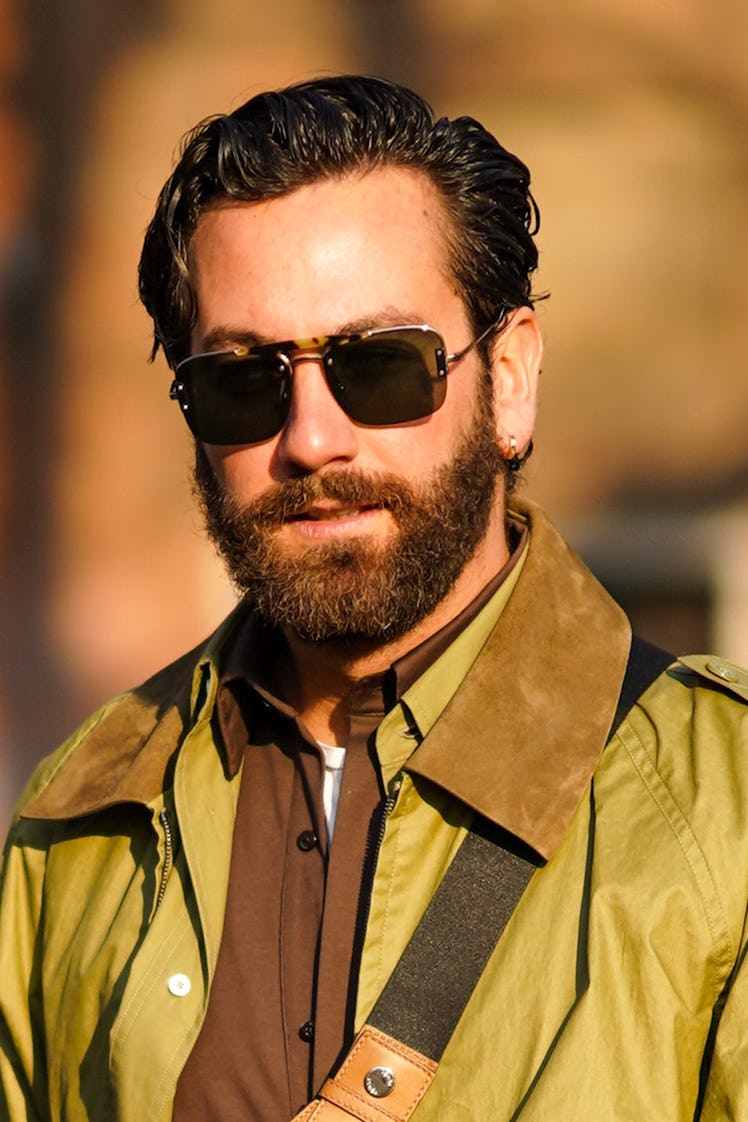 A man with beard wearing Rayban “Caravan” glasses