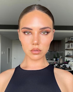 A model shows off a blush-centric makeup look