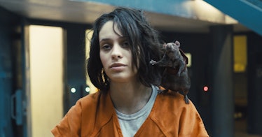 Daniela Melchior stands with a rat on her shoulder in The Suicide Squad
