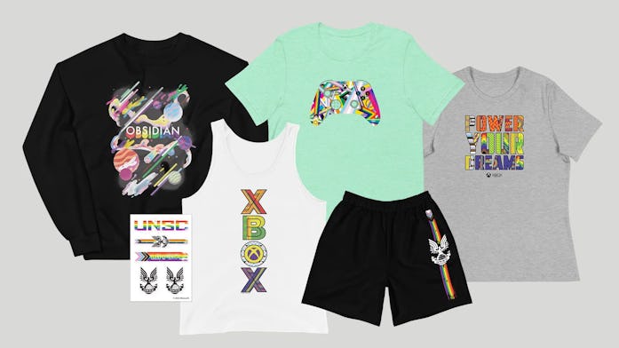 A photo of Xbox's new Pride merch, including a T-shirt, sweatshirt, shorts, and tank top