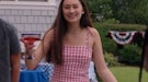 Belly Conklin wearing a red gingham dress on the 4th of July in 'The Summer I Turned Pretty'.