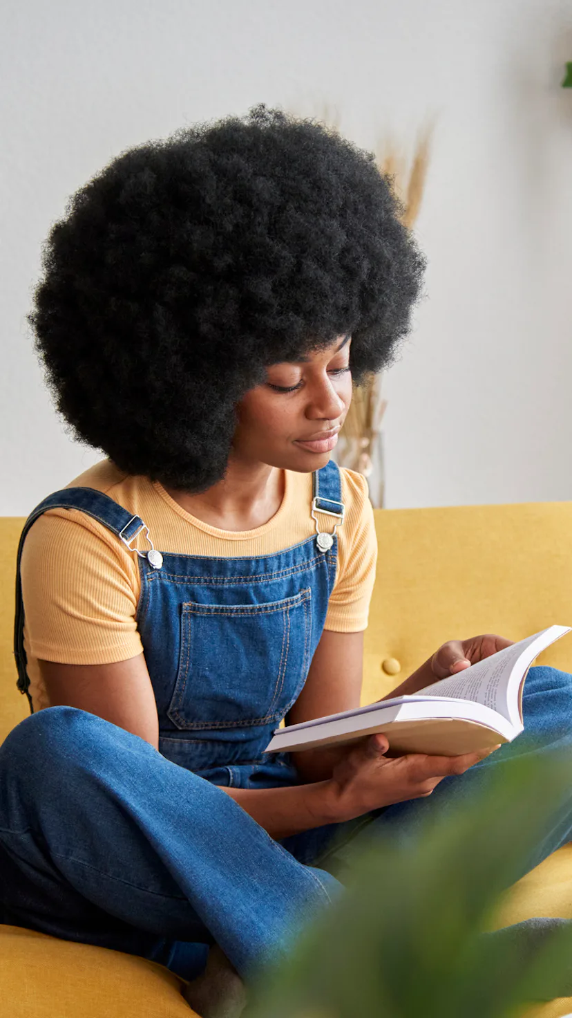 Woman reading book.