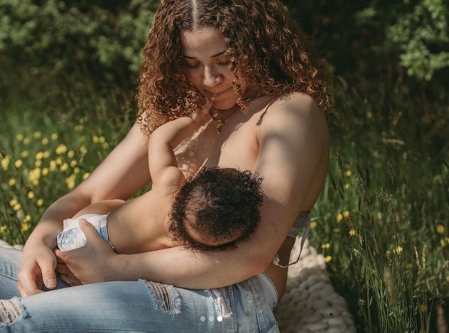 mother and child breastfeeding outside