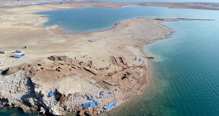 Aerial view of the excavations at Kemune with Bronze Age architecture partly submerged in the lake