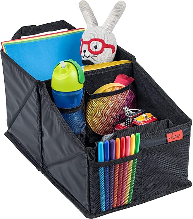 A middle seat car organizer keep your child's drink, toys, and tablet within their reach on long car...
