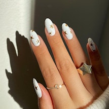 These manicure ideas for 4th of July nails go beyond red, white, and blue. Try a double French manic...