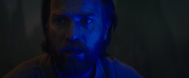 Ewan McGregor's Obi-Wan lit by the blue light of his lightsaber in Obi-Wan Kenobi Episode 6