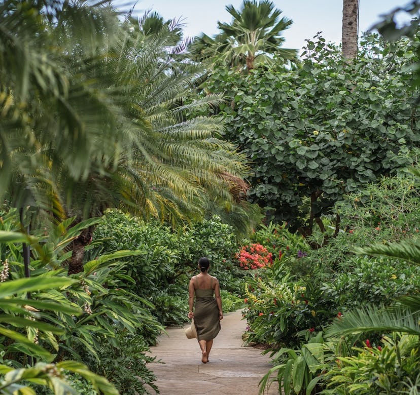 Woman walking through the island of Lanai jungle