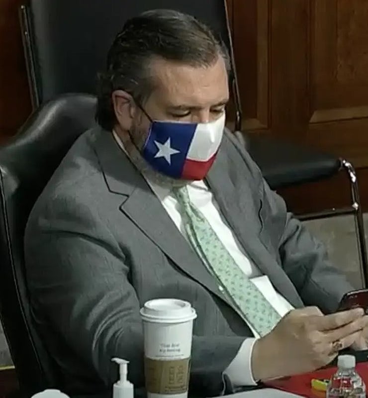 Ted Cruz looking at phone