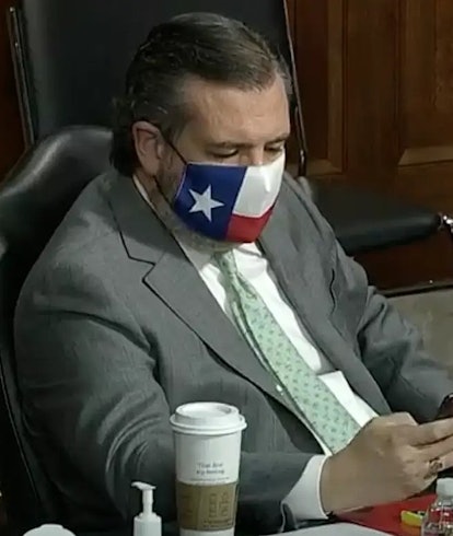Ted Cruz looking at phone