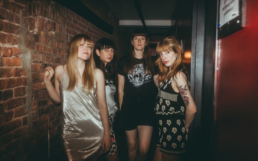 The Los Bitchos band members preparing for their 2022 New York City concert