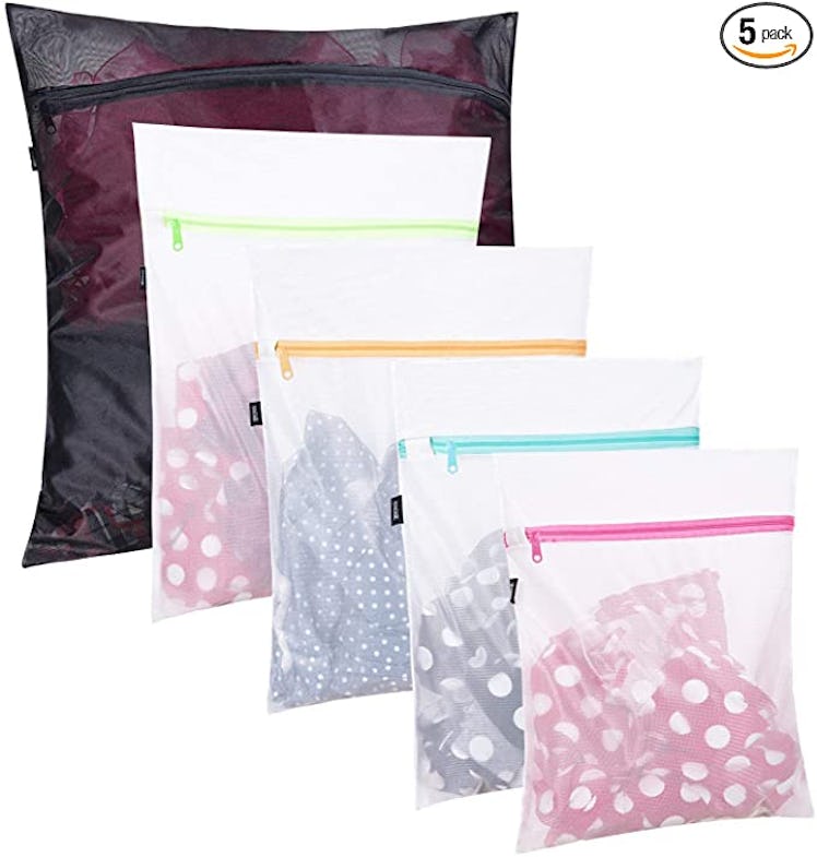 set of 5 laundry bags with clothing inside