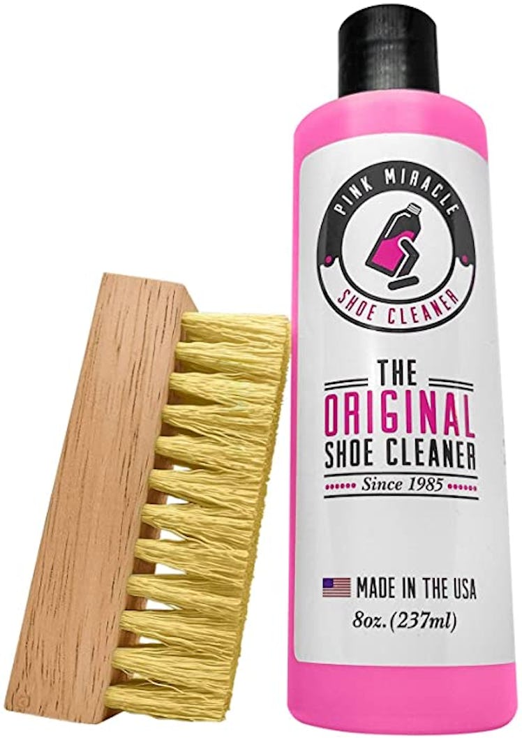 bottle of pink miracle shoe cleaner and scrub brush