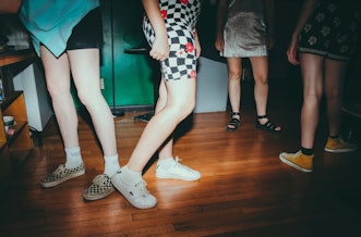 The Lost Bitchos band members are wearing shorts and skirts as well as Vans and Converse sneakers