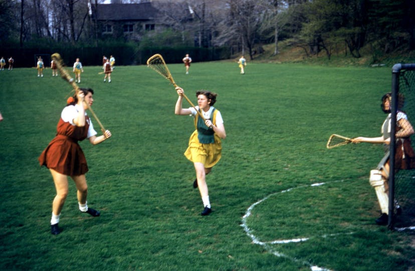 Bryn Mawr students play lacrosse in 1955.