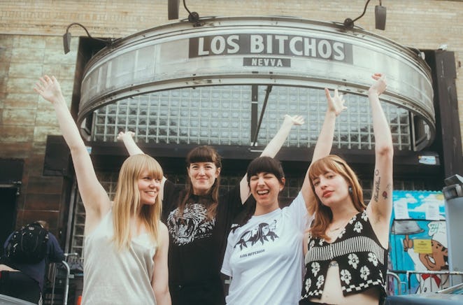 The Los Bitchos band members posing in front of the Music Hall of Williamsburg in New York