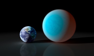Illustration showing Earth on the left and a larger ocean world on the right.