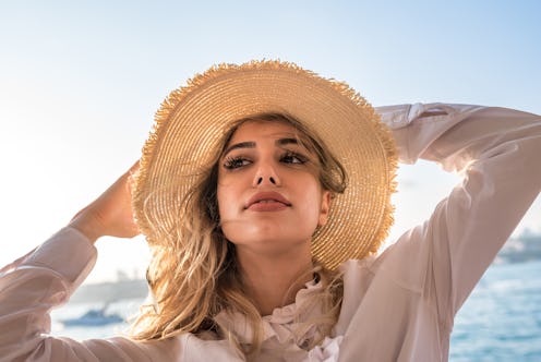 How to protect your scalp from the sun, according to derms.