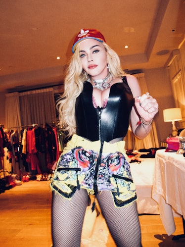 Madonna in bustier and baseball cap. 