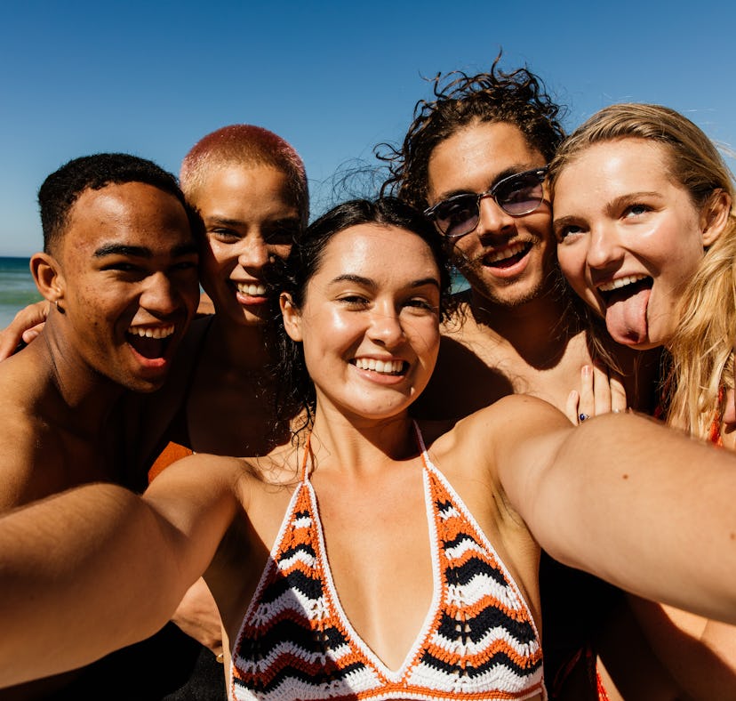 A group of friends taking a picture before having the best month of July 2022, per their zodiac sign...