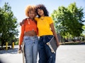 Young pair with their skateboards, having the worst month of July 2022, per their zodiac signs' horo...