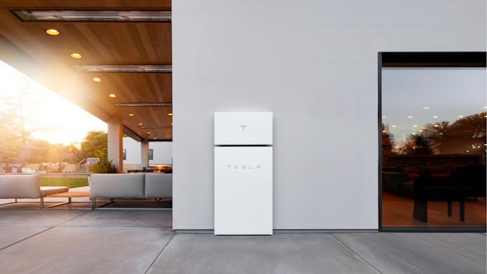 Tesla Powerwall+ energy storage unit installed outside home promotional image