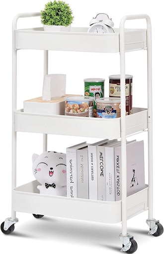 3-tier rolling cart in white with items atop it