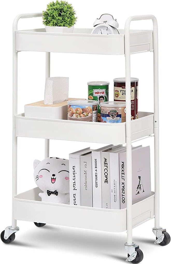 3-tier rolling cart in white with items atop it